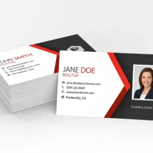 Stack of printed real estate business cards with front and back design shown