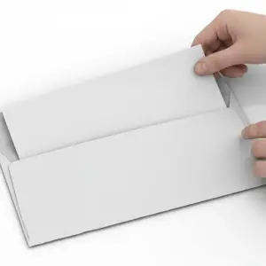Hands placing a folded printed document into a white business envelope for mailing