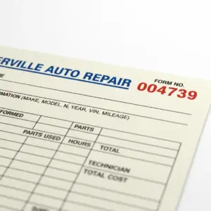 Custom auto repair service form with red sequential numbering printed by PSW Copy Center